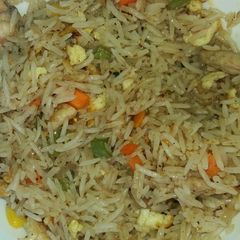 A picture of Mix vegetable and chicken fried rice.
