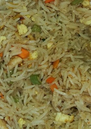 A picture of Mix vegetable and chicken fried rice.
