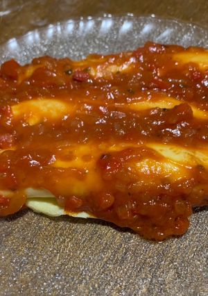 Una foto de Canelones con salsa pizzera
