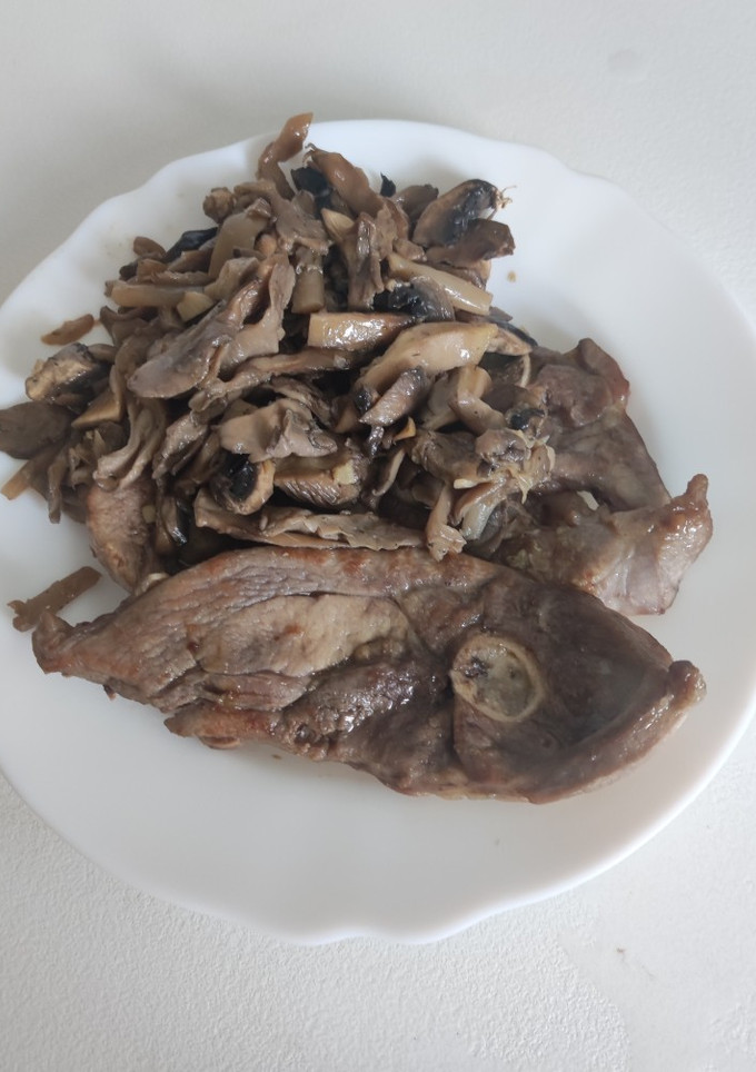 Una foto de Filete de pavo y setas a la plancha