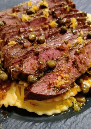 A picture of Flat iron steak with caper and tarragon brown butter.