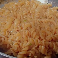 A picture of Spicy pasta with boil Egg.