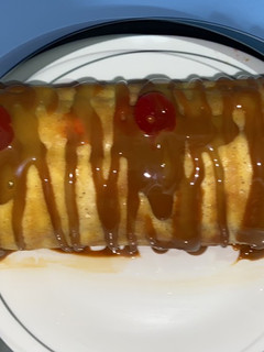 Una foto de Pionono de dulce de leche