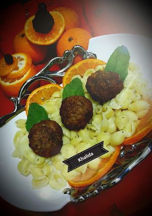 A picture of Creamy pasta with mutton orange meatballs.