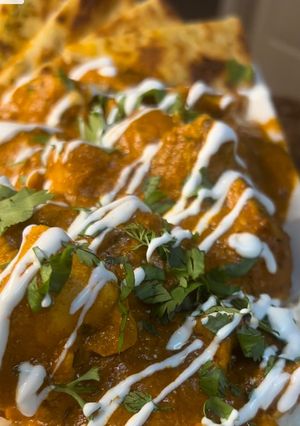 A picture of Butter Chicken/ Garlic Naan.