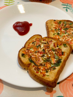 A picture of Bread pizza -Breakfast Menu.