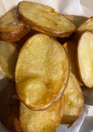 Una foto de Papas doradas en mantequilla