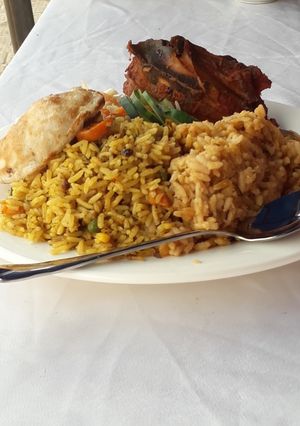 A picture of Jollof rice with chicken.