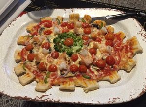 Una foto de Corona pizza