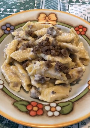 A picture of Garganelli with Béchamel and Sausage.