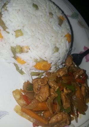 A picture of Vegetables rice and chicken stir fry.