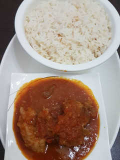 A picture of Beef stew and rice.