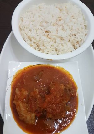 A picture of Beef stew and rice.
