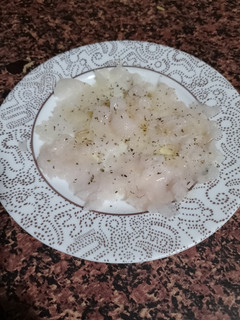 Una foto de Carpaccio de Merluza