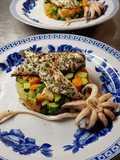 Branzino con caponata di verdure e seppie