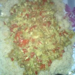 A picture of Couscous wit egg sauce.