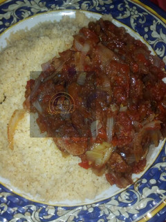 A picture of Cous cous with sauce.