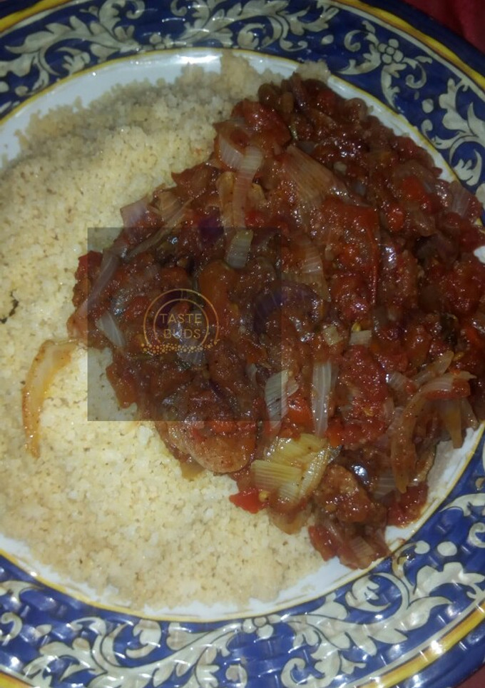 A picture of Cous cous with sauce.