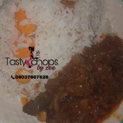 A picture of White rice with meat sauce.