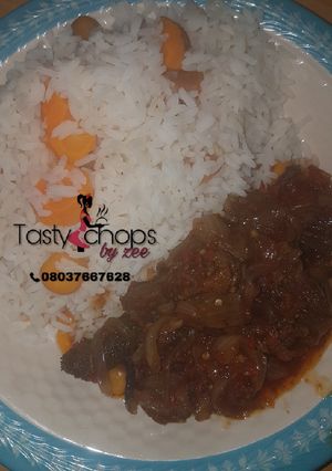 A picture of White rice with meat sauce.