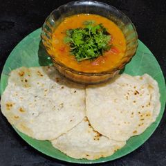A picture of Maida chapati with kurma.