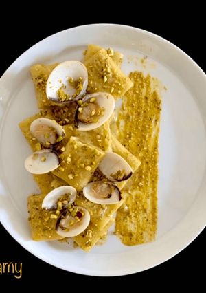 A picture of Paccheri with Clams and Pistachio Pesto.