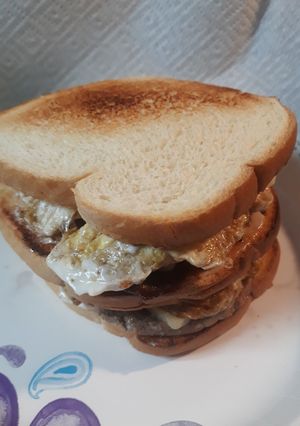 A picture of Peppered Beef, Eggs, and Cheese Sandwich.