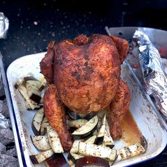 Beer can chicken on the Braai (BBQ) with coal charred corn on the cob A picture of Beer can chicken on the Braai (BBQ) with coal charred corn on the cob.