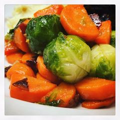A picture of Garlicy Brussels Sprouts and Carrots with Crispy Bacon.