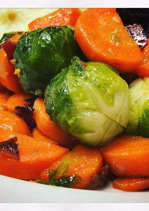 A picture of Garlicy Brussels Sprouts and Carrots with Crispy Bacon.