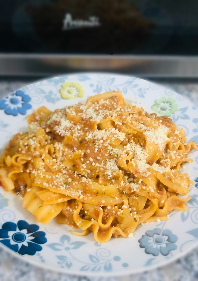 Una foto de Pasta a la boloñesa y bechamel