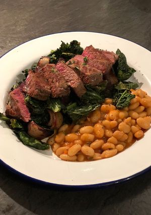 A picture of Venison with roast cavolo nero and beetroot. Stewed cannellini beans 🦌.