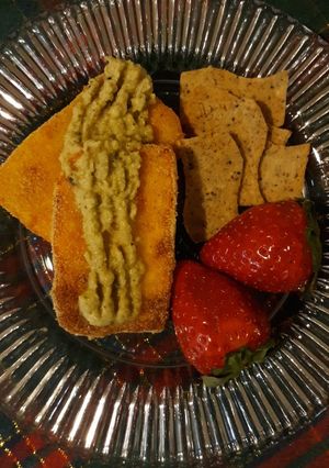 A picture of Oven baked paneer topped with chutney or fruit jam.