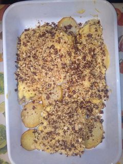 Una foto de Merluza con jamón serrano y mayonesa de azafrán