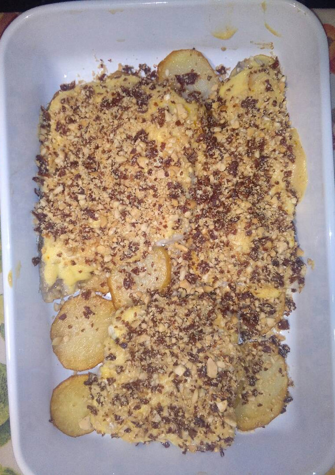 Una foto de Merluza con jamón serrano y mayonesa de azafrán