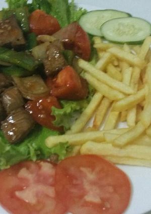 A picture of Shaking Beef with French Fries.
