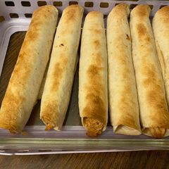 A picture of Bbq chicken bacon taquitos.