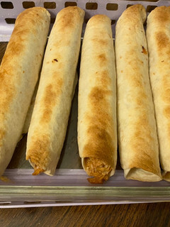 A picture of Bbq chicken bacon taquitos.