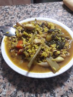 Una foto de Arroz caldoso de los tres puñados