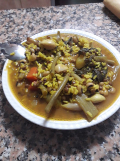 Una foto de Arroz caldoso de los tres puñados