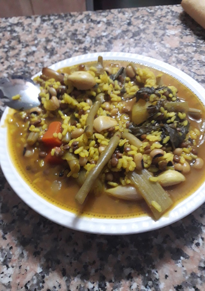 Una foto de Arroz caldoso de los tres puñados