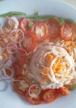 A picture of Mashed potatoes,arrowroot and vegetable salad.