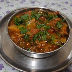 A picture of Vidarbha special Nagpuri style Wanga batata Saoji masala bhaji.