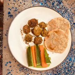 A picture of The forever best canned chickpea falafel with yoghurt sauce and GF flatbread.