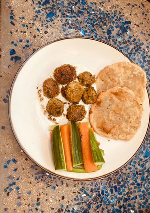 A picture of The forever best canned chickpea falafel with yoghurt sauce and GF flatbread.