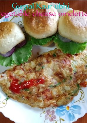 A picture of Vegetable cheese omelette 🍞🥚🍅🫑🥔🧅🌶️.