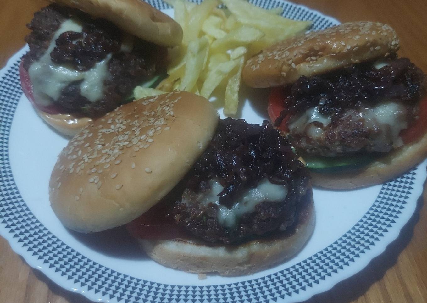 Beef-lamb burger with caramelized onions,cheese, tomato&cucumber