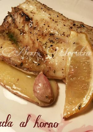 Una foto de Dorada al horno, con patatas y ajos