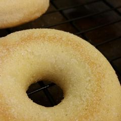 A picture of Hint of Cinnamon Baked Sugar Doughnuts.