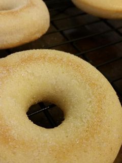 A picture of Hint of Cinnamon Baked Sugar Doughnuts.